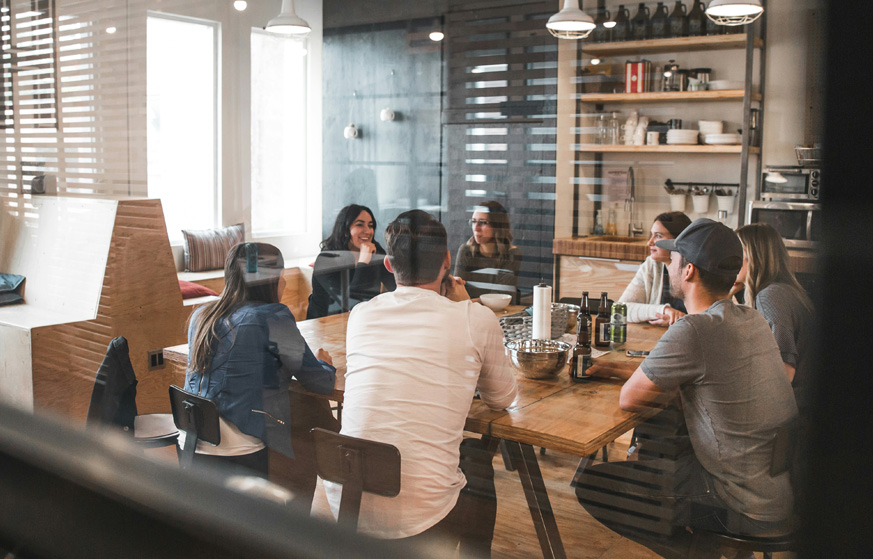 Group of people having a meeting in a well lit room.